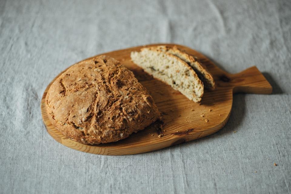 A loaf of fresh bread on a wooden board